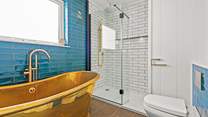 The dreamy bathtub is perfect for a blissful soak. 