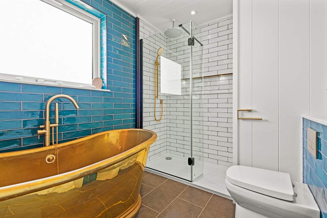 The dreamy bathtub is perfect for a blissful soak.