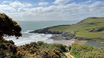 You can wander down to the magical beach of Mansands via the coastal path.