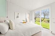 The bedrooms are decorated in muted tones for a restful night.