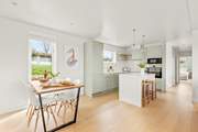 Light and bright, the kitchen/dining area is very inviting.
