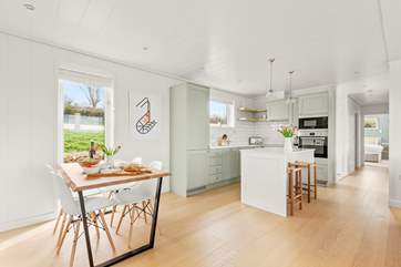 Light and bright, the kitchen/dining area is very inviting.