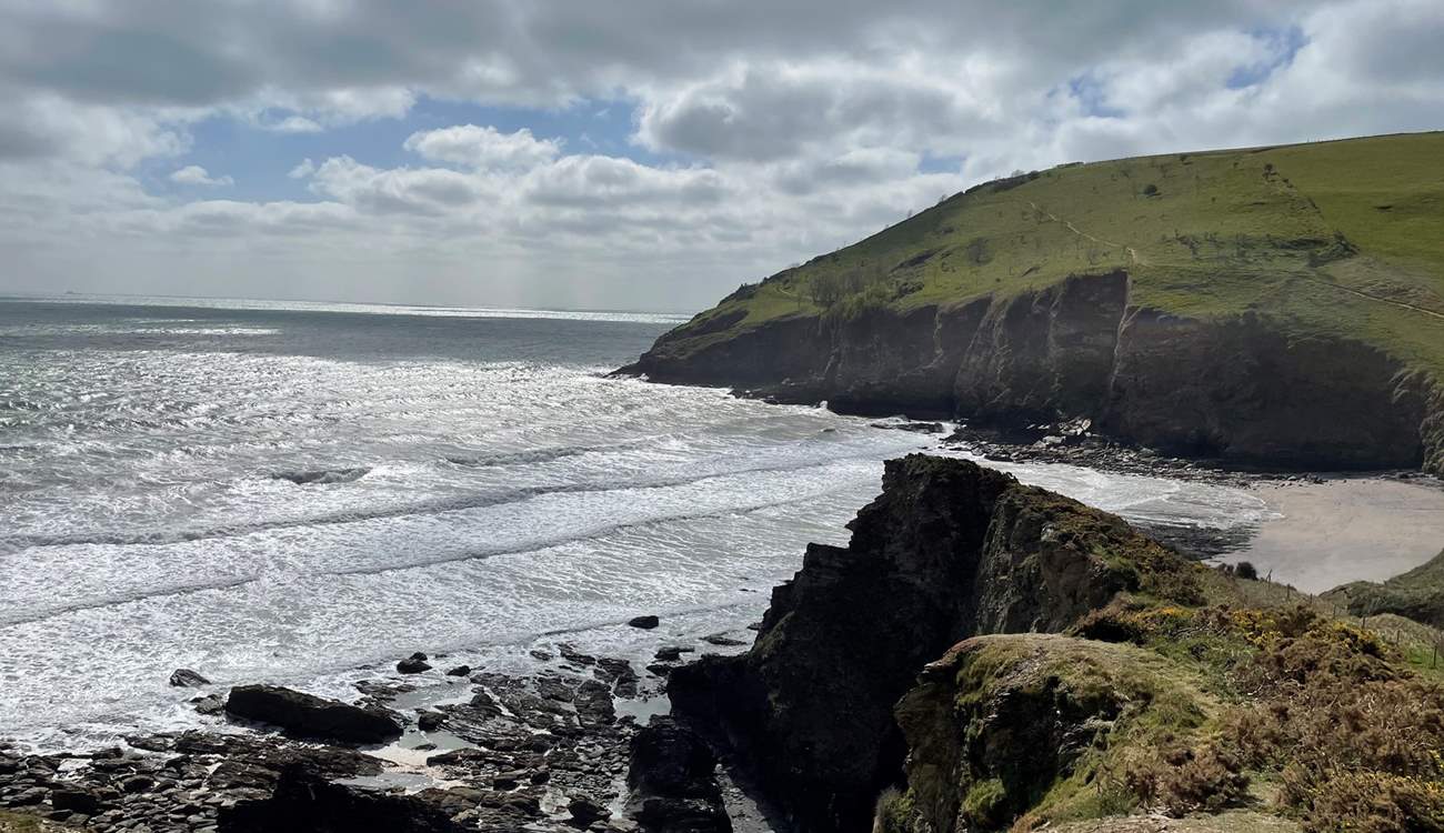 You can wander down to the magical beach of Mansands via the coastal path.