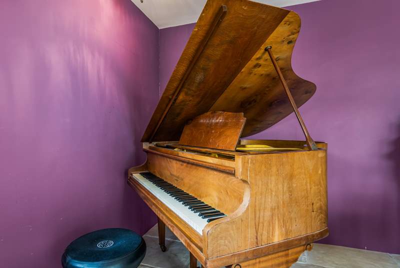Play a tune on the amazing grand piano.