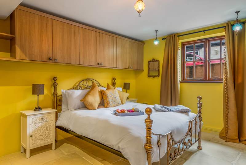 Bedroom 1 is a cheerful king-size room on the ground floor.