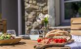 The wooden dining area makes al fresco dining a dream. - Thumbnail Image