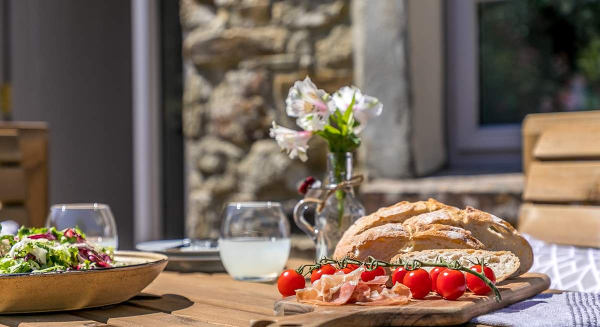 The wooden dining area makes al fresco dining a dream.