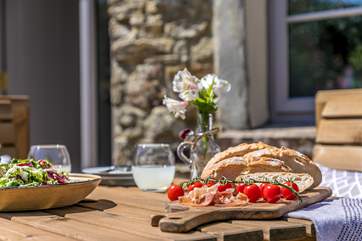 The wooden dining area makes al fresco dining a dream.
