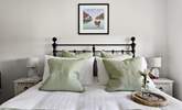 Sink into the gorgeous king-size bed. - Thumbnail Image