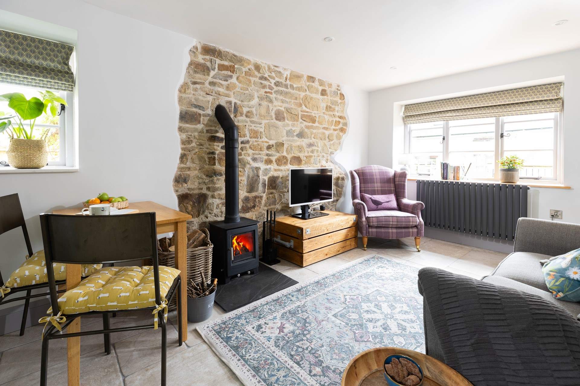 A warm welcome awaits. You will instantly relax into the cosy interior after a big day of exploring. The TV has been replaced with a new wall mounted 43 inch Smart TV.