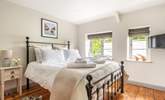 Sink into the gorgeous king-size bed. - Thumbnail Image