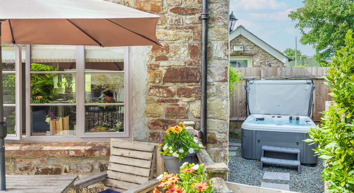 From the decking walk around to the hot tub.