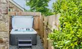 Enjoy relaxing in the bubbling hot tub. - Thumbnail Image