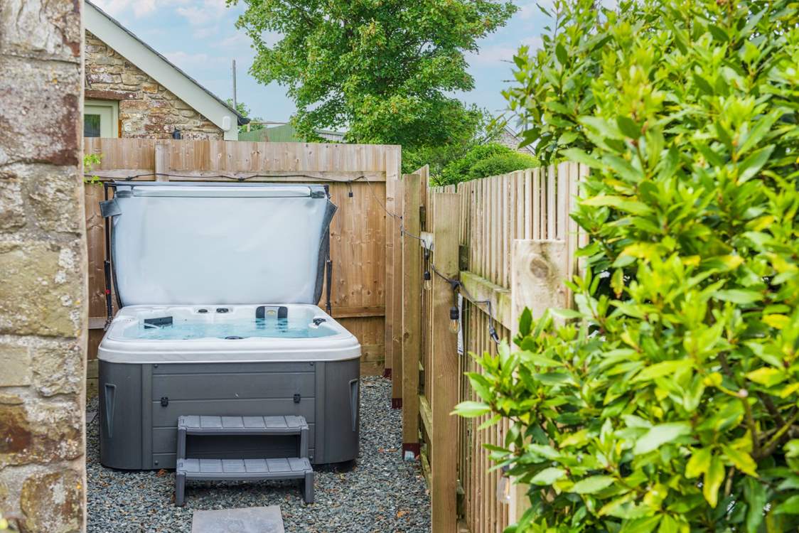 Enjoy relaxing in the bubbling hot tub.