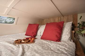 The cosy, raised double bed is idyllic for a peaceful night's sleep.