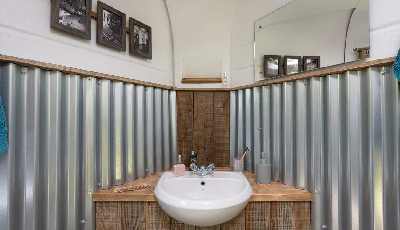 Upcycled and handcrafted features also run throughout the shower-room. 
