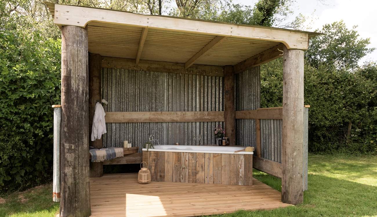 Complete with a beautiful outdoor bath tub to soak your cares away.