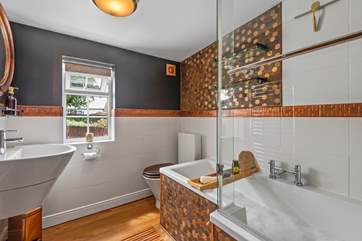 Relax in the fabulous family bathroom.