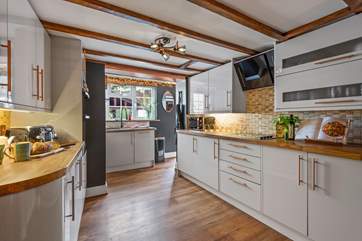 The modern kitchen provides the ideal place to prepare delicious meals.