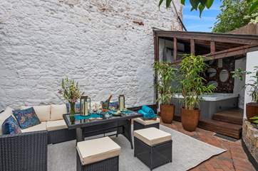 Enjoy a spot of al fresco dining in the brilliant outside space.