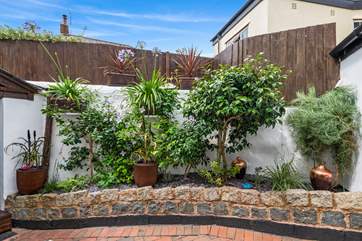 The garden is enclosed by a wooden fence to ensure your privacy.