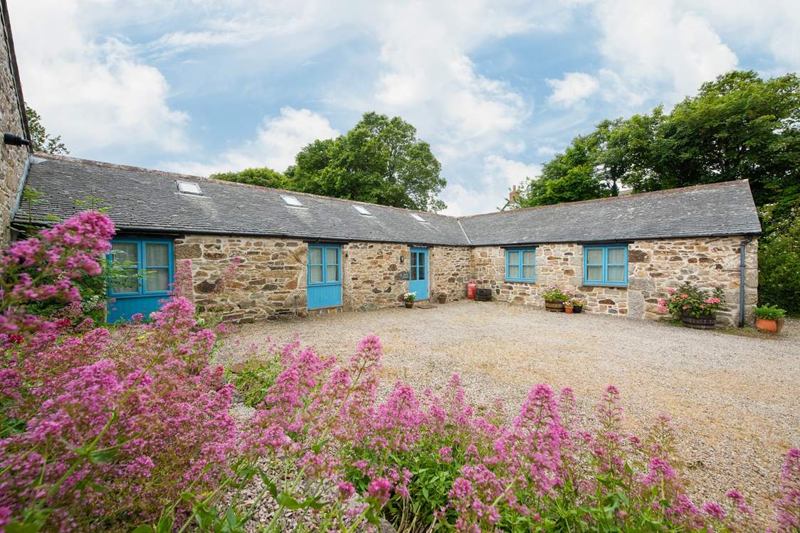The entrance and parking area. Open up the front door and take a step up into the welcoming hallway.