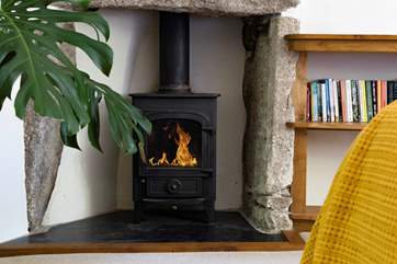 A fabulous wood-burning stove sits snugly in the corner.