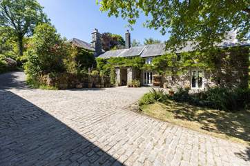 There is a private parking space tucked away up the hill but you can use the courtyard to drop anything off.