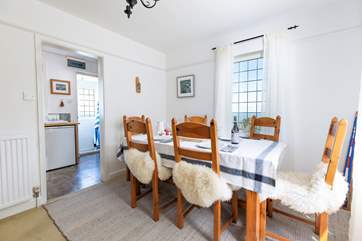 The dining-room sits conveniently next to the kitchen.