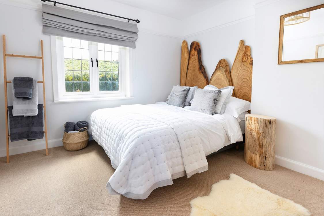 This gorgeous bedroom has the most fabulous feature headboard.