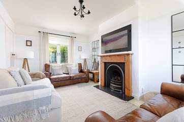 The sitting-room is beautifully furnished with comfort in mind.