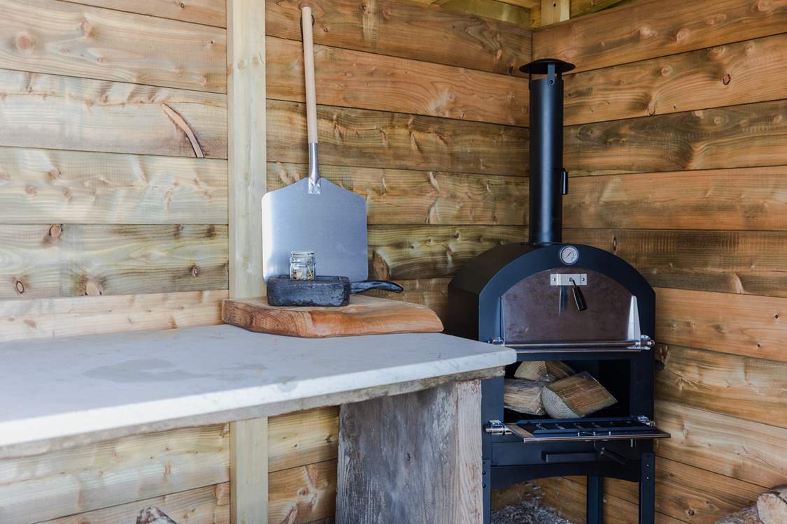 The wood store is home to the barbecue.