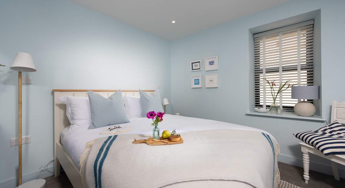 Bedroom 2 is a lovely room decorated in calming, coastal tones.