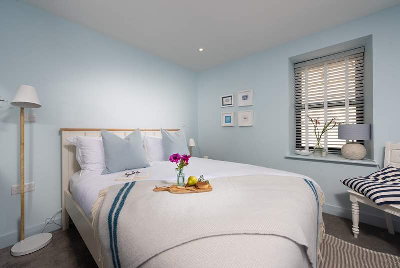 Bedroom 2 is a lovely room decorated in calming, coastal tones.