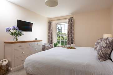 Bedroom 4 can be a super-king or a twin, and has lovely views of the church.
