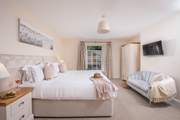 Lovely bedroom 3 has a sweet seating-area.