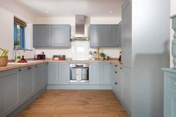 The stylish kitchen has all you need to create a holiday meal, including the all important dishwasher.
