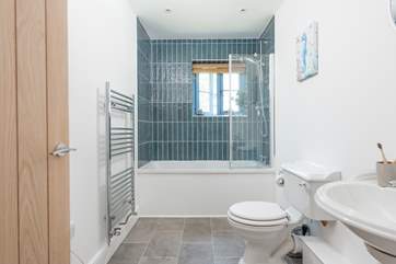 The super en suite has a bath with shower over.