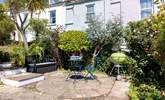 The pretty garden has several secluded spots, the L shape sofa will be moved to this position to make the most of the last of the evening sun with views down to the estuary. - Thumbnail Image