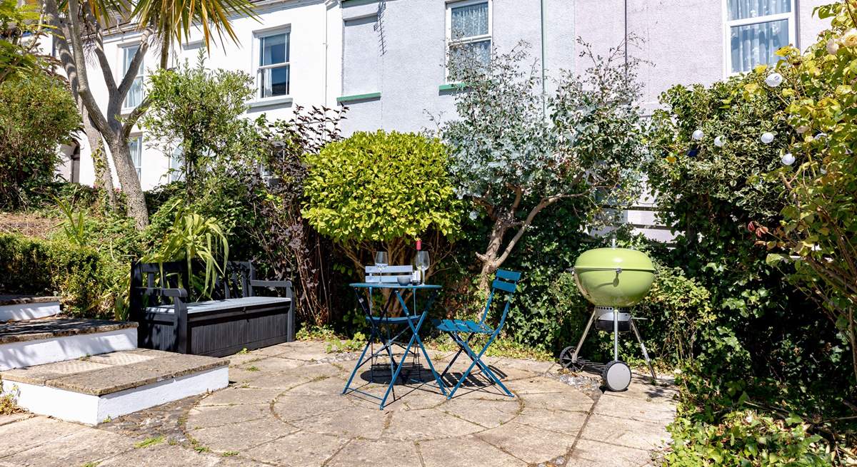 The pretty garden has several secluded spots, the L shape sofa will be moved to this position to make the most of the last of the evening sun with views down to the estuary.