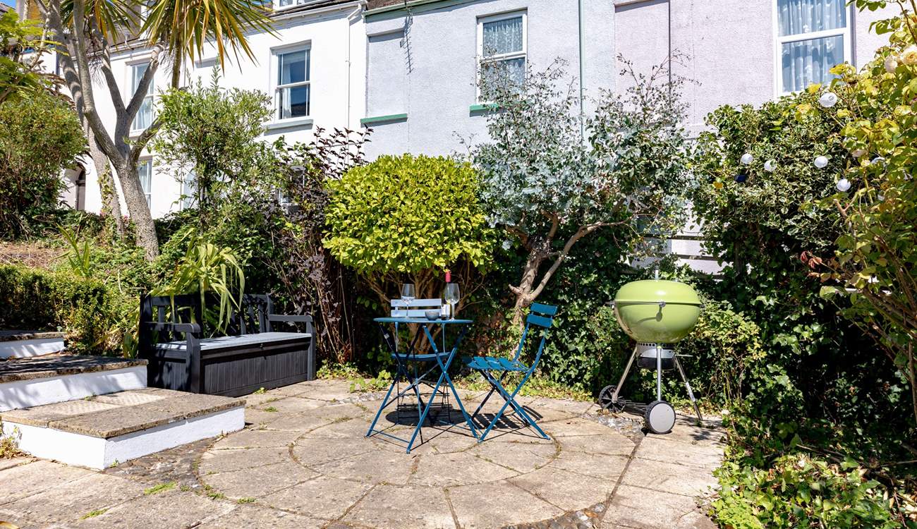 The pretty garden has several secluded spots, the L shape sofa will be moved to this position to make the most of the last of the evening sun with views down to the estuary.