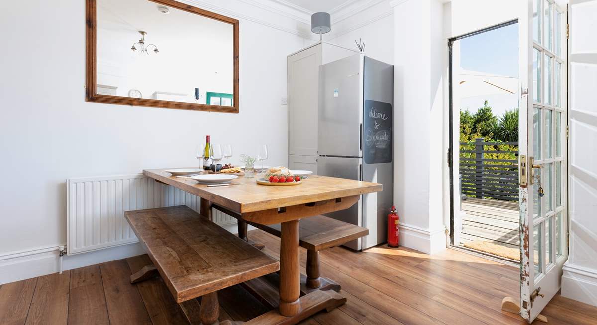 At meal times you can choose to dine either at the gorgeous refectory table in the kitchen/diner or sit in the Devon sunshine on the terrace outside. The kitchen table can seat eight guests and there are two extra chairs in the cupboard.