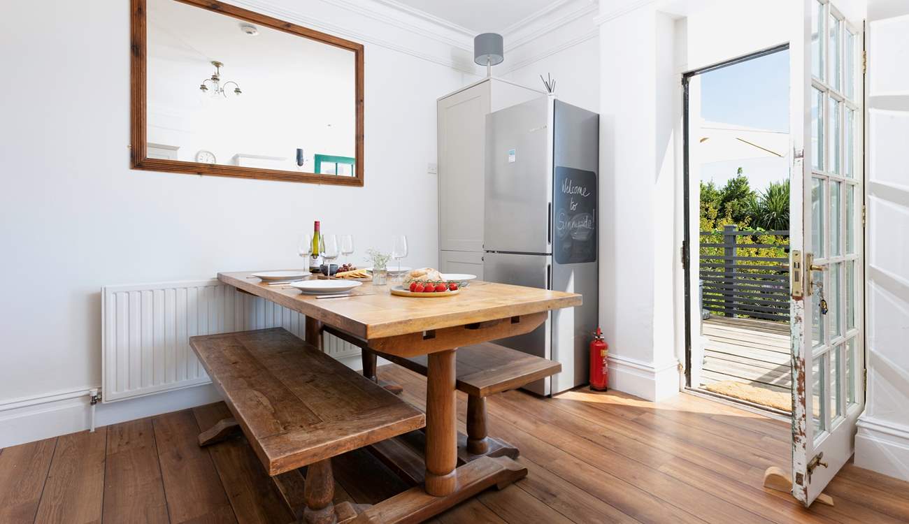 At meal times you can choose to dine either at the gorgeous refectory table in the kitchen/diner or sit in the Devon sunshine on the terrace outside. The kitchen table can seat eight guests and there are two extra chairs in the cupboard.