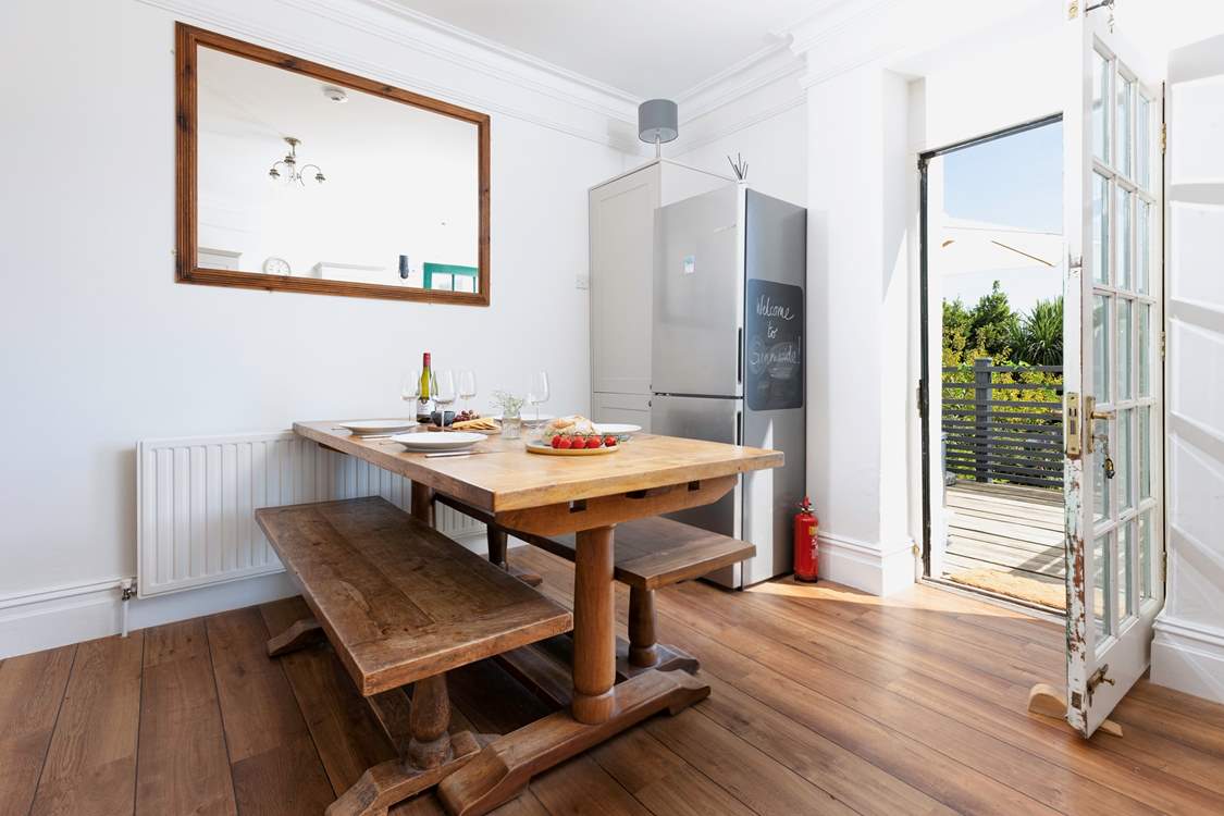 At meal times you can choose to dine either at the gorgeous refectory table in the kitchen/diner or sit in the Devon sunshine on the terrace outside. The kitchen table can seat eight guests and there are two extra chairs in the cupboard.