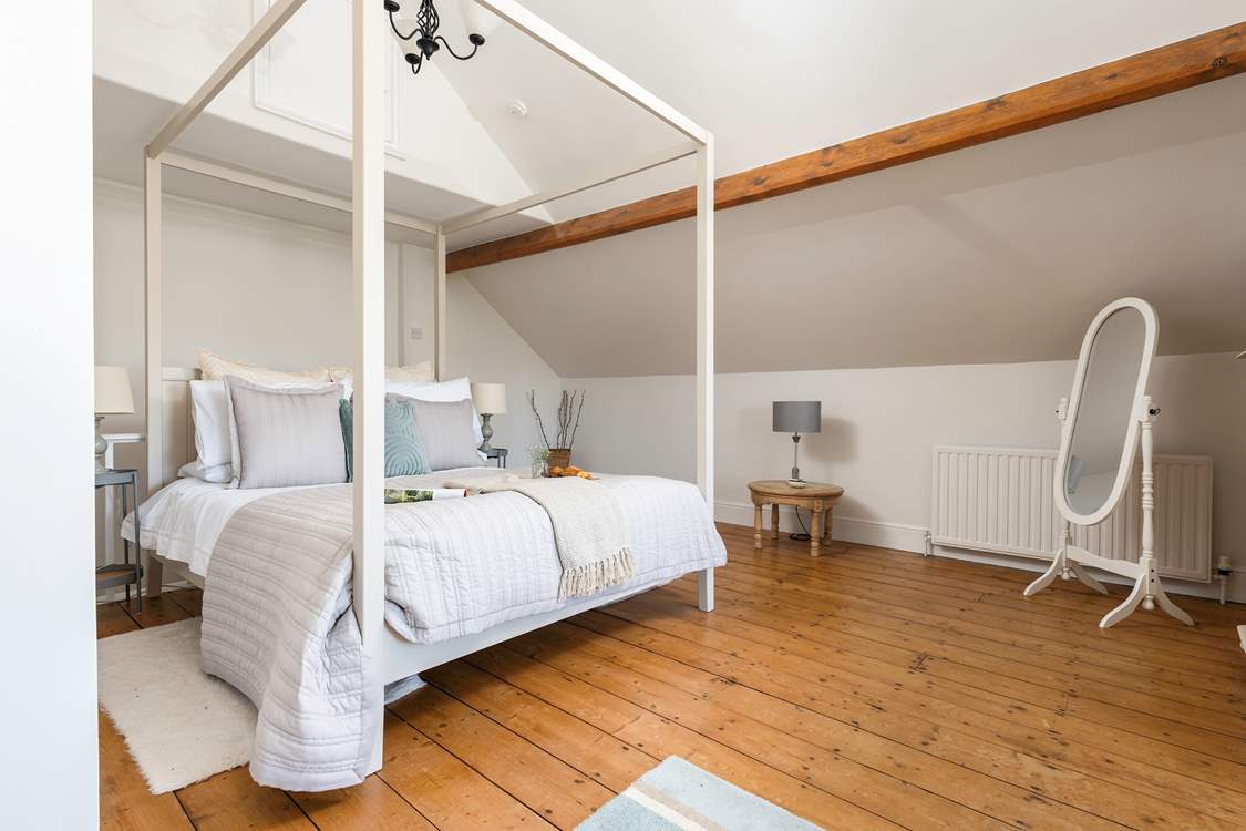 Gorgeous bedroom 4 is simply stunning, with a king-size double bed, en suite bathroom and gorgeous views towards the estuary.