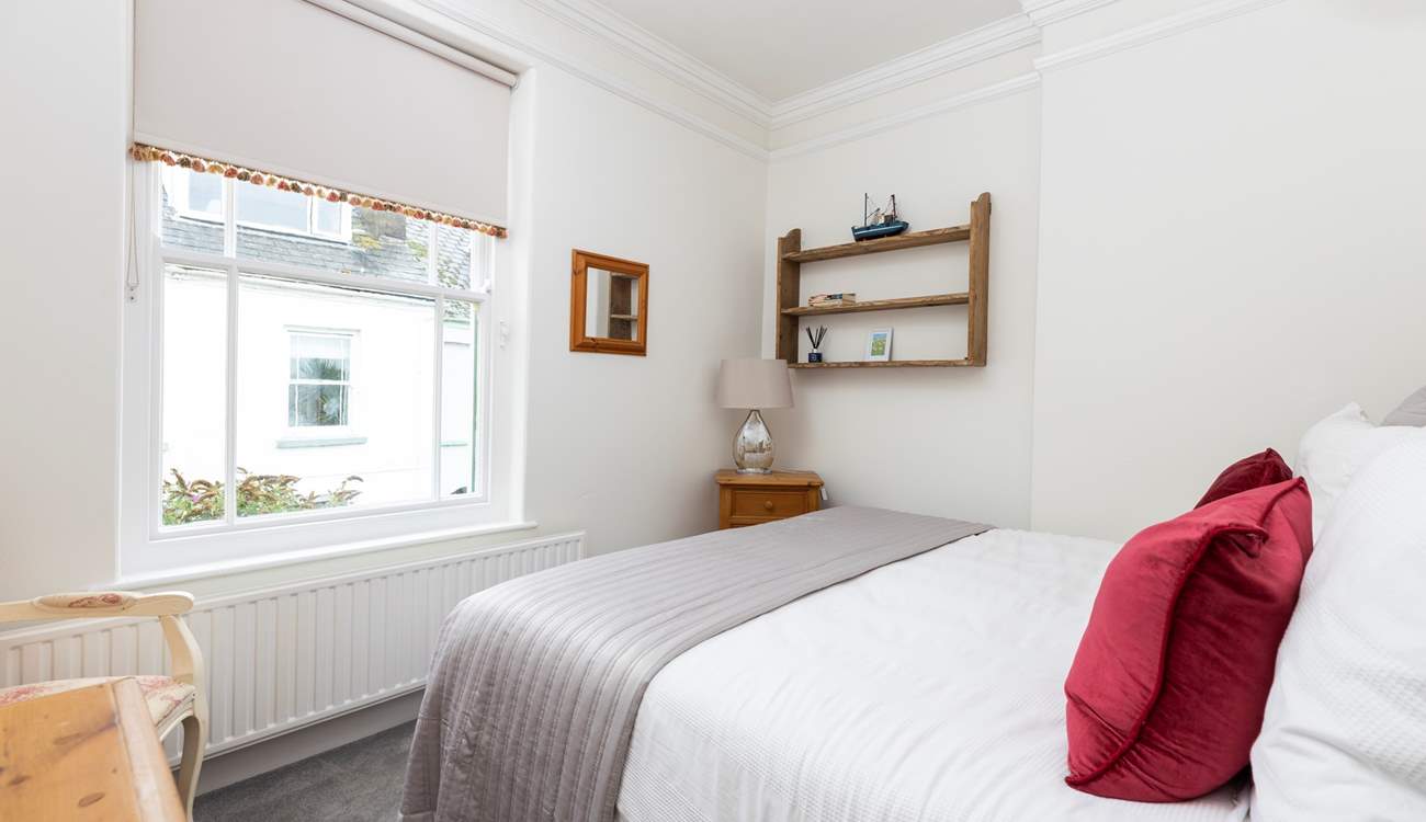 Bedroom 3 looks out to the side of the house.