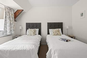 Bedroom two with its 'zip and link' beds set up as twin beds.