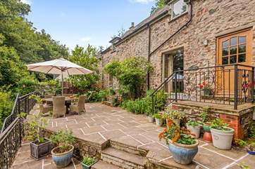 The outside space is surrounded by beautiful greenery.