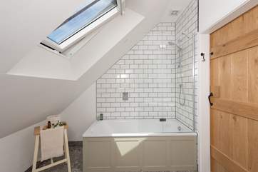 Unwind after a day on the beach in the modern shower.