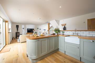 Pastel tones and wooden details create a lovely, welcoming atmosphere.